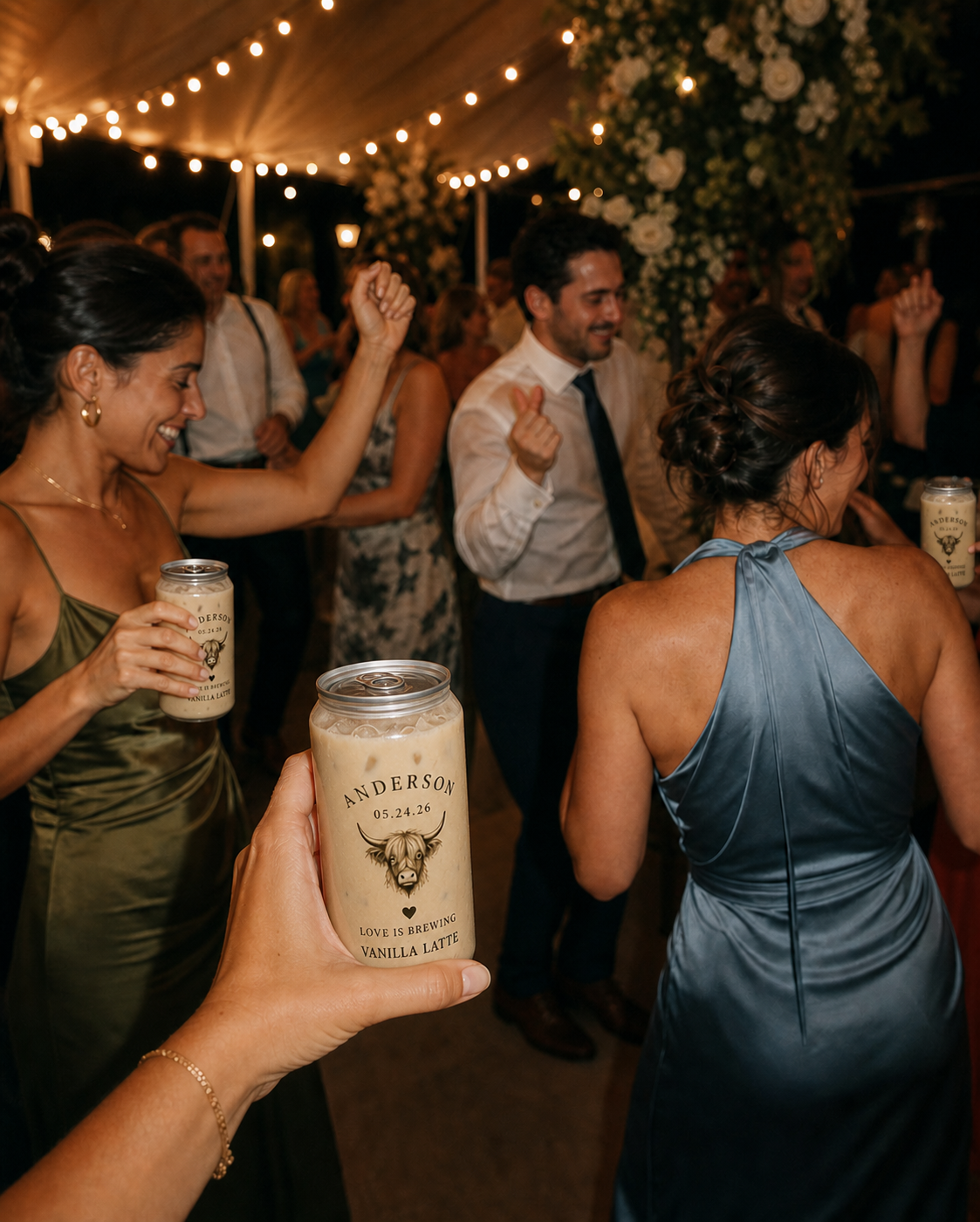 Wedding guests dancing with personalized Coastal Cow iced latte cans